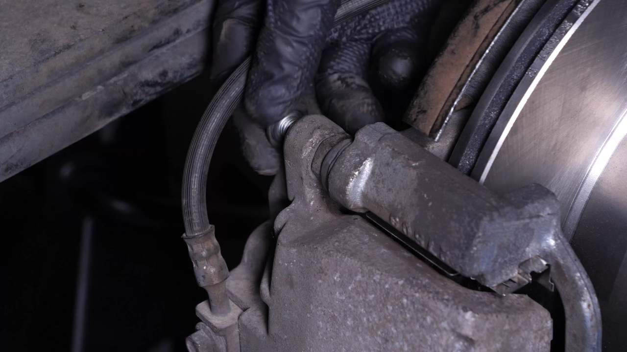 Put the brake caliper back