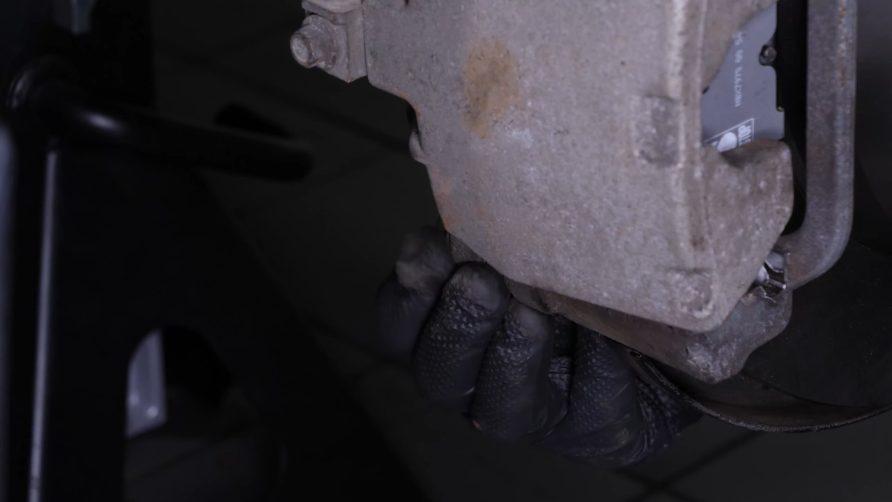 Put the brake caliper back