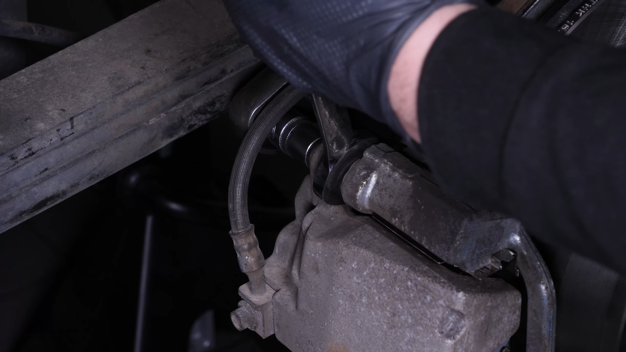 Put the brake caliper back