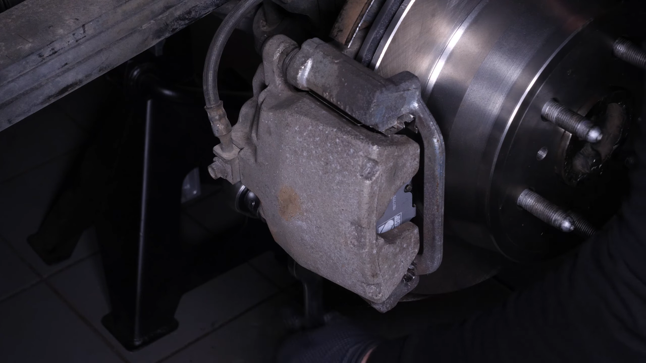 Put the brake caliper back