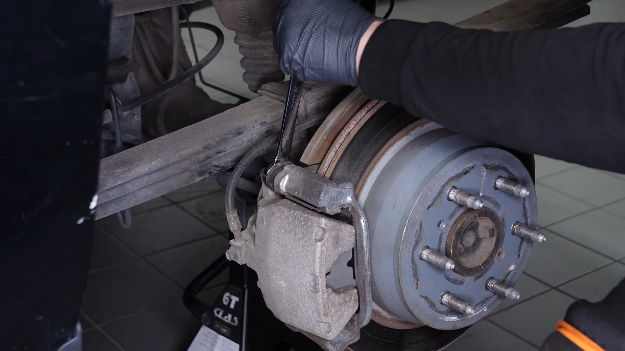 Remove the brake caliper