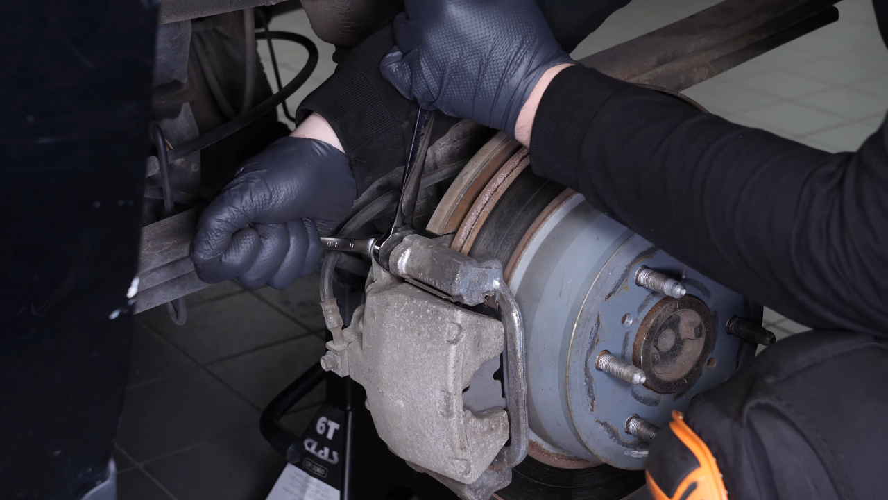 Remove the brake caliper