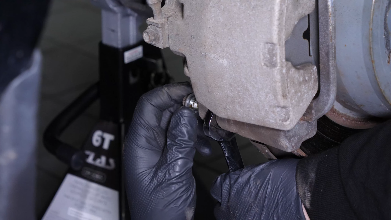 Remove the brake caliper