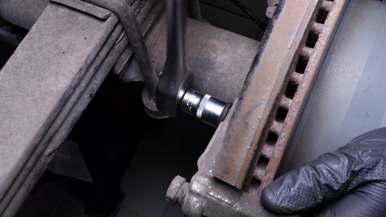 Remove the brake caliper mount