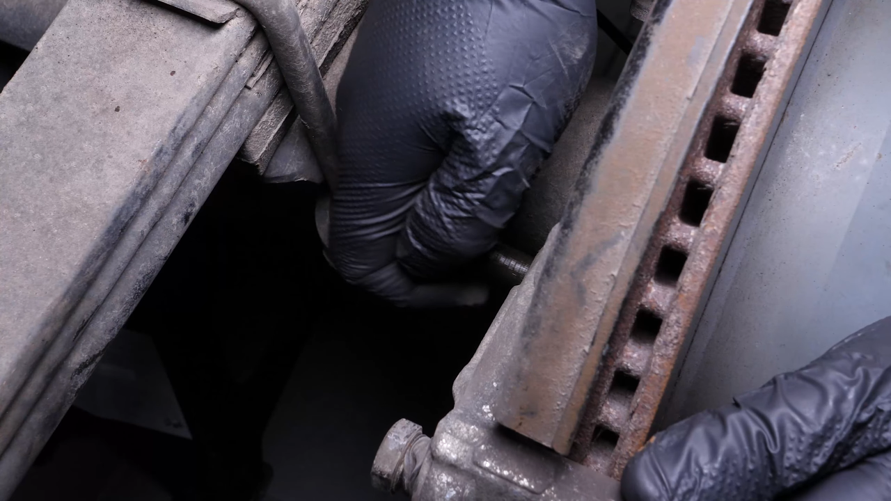 Remove the brake caliper mount