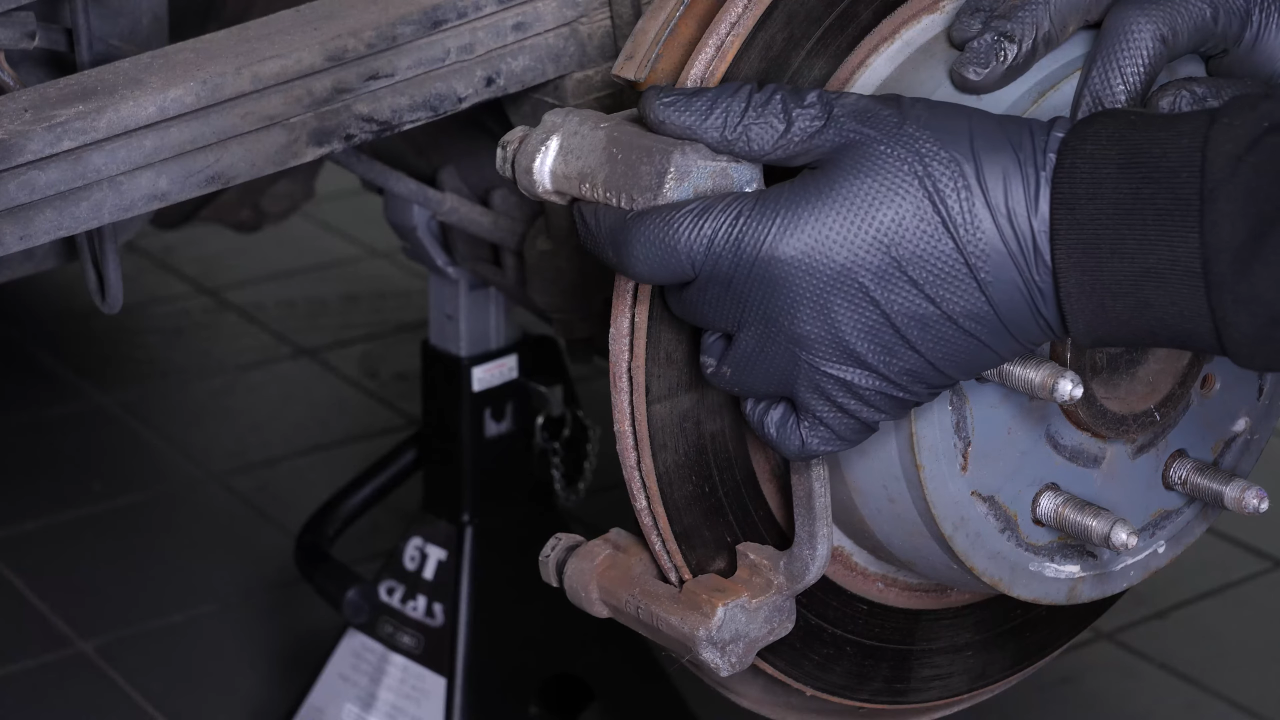 Remove the brake caliper mount