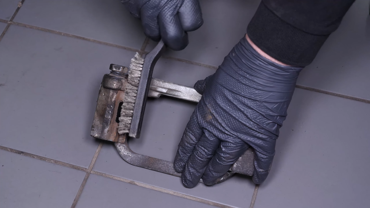Clean the brake caliper mount