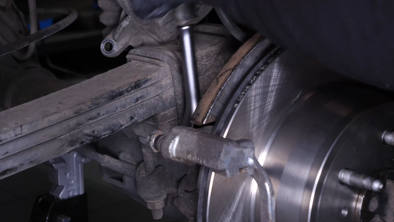 Put the brake caliper mount back on