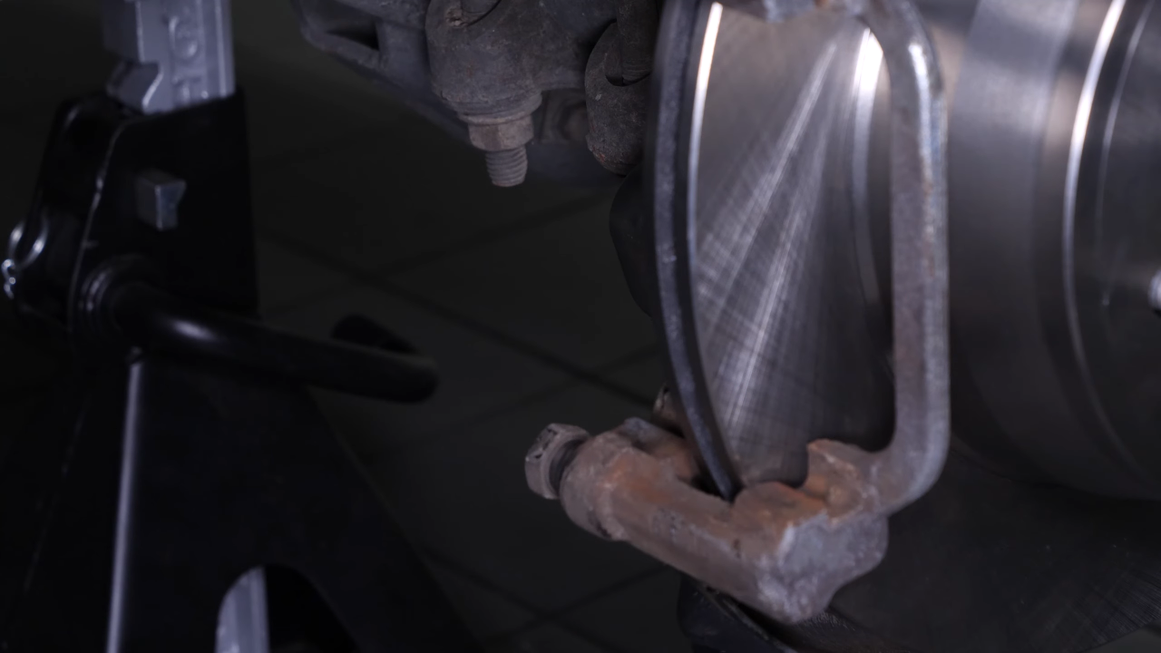 Put the brake caliper mount back on