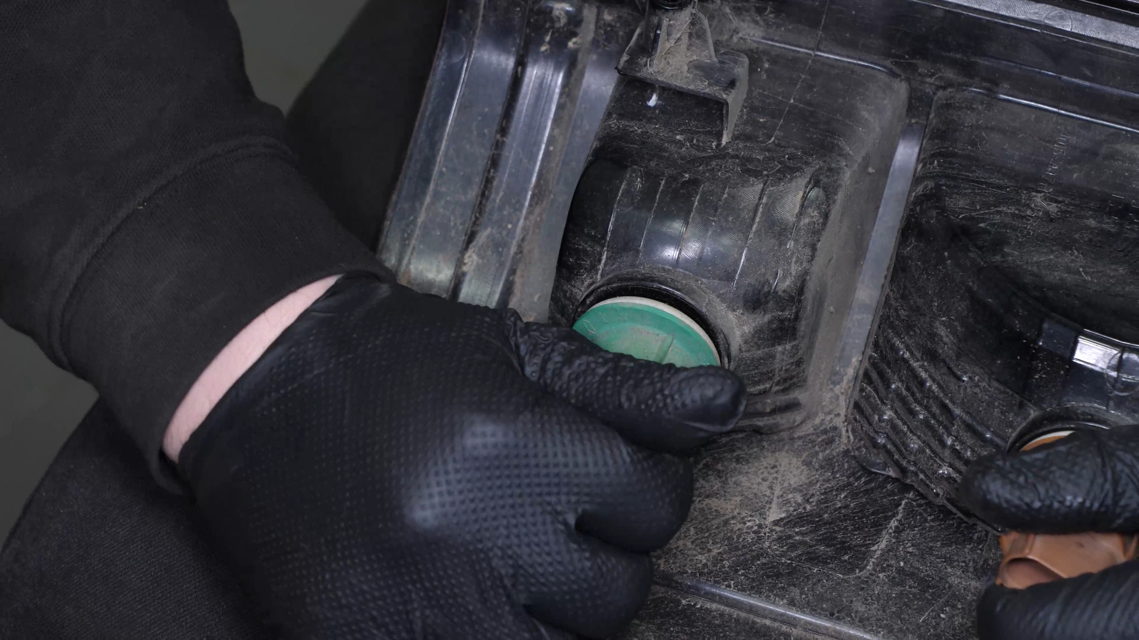 Replace the reverse light bulb