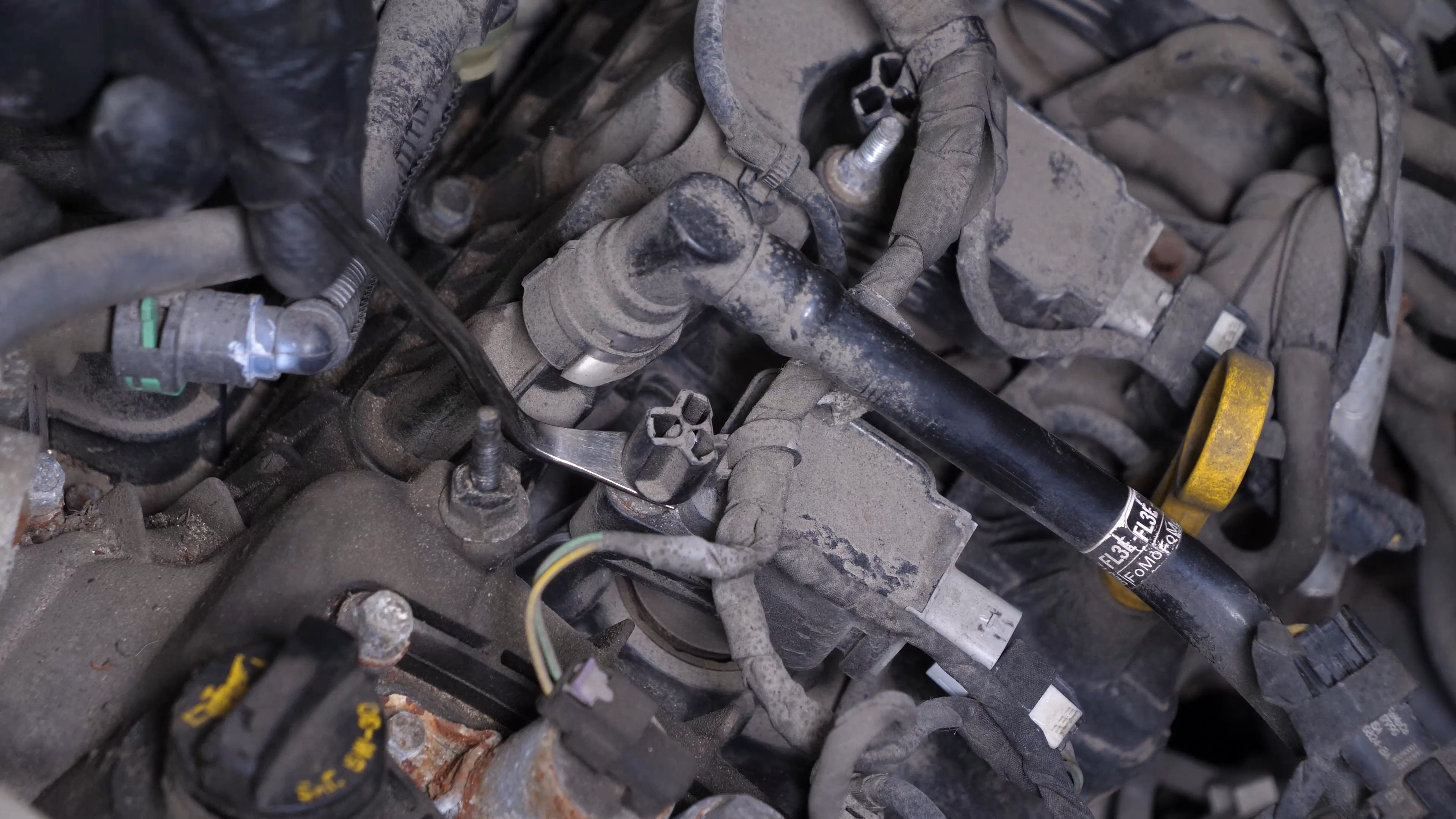 Disconnect the ignition coil