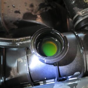 open radiator filler neck with green antifreeze