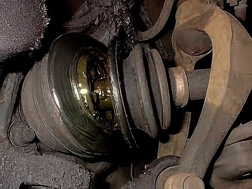 outer CV joint and axle assembly with damaged CV boot