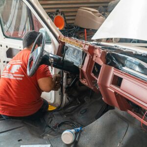 mechanic working on clutch master cylinder