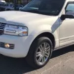 man parking his lincoln navigator