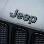 jeep logo on jeep parked outside scaled