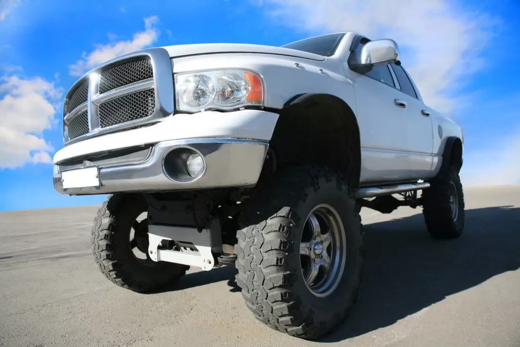 semi front shot of a lifted pickup truck