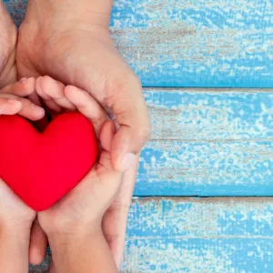 mom kid heart in hands