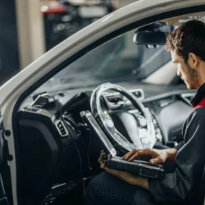 car mechanic checking vehicle