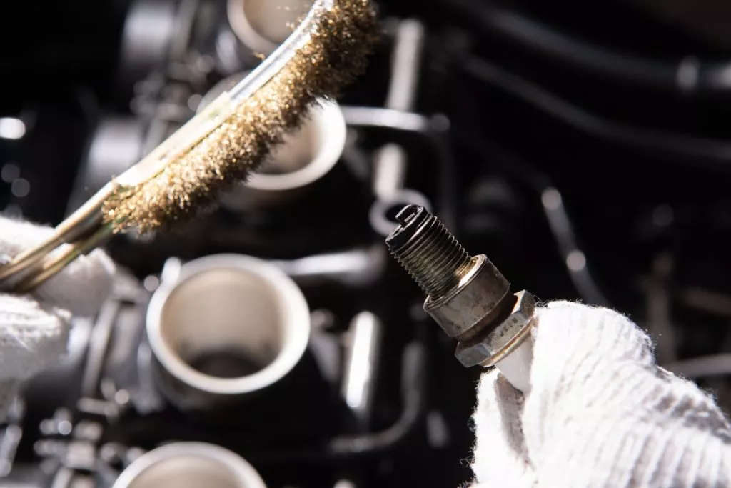 Man fixing spark plug