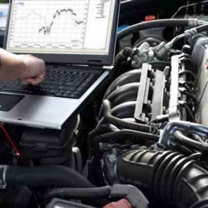 mechanic checking car engine