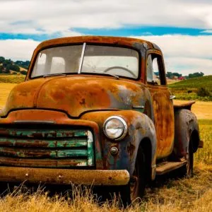rusty truck left in the field