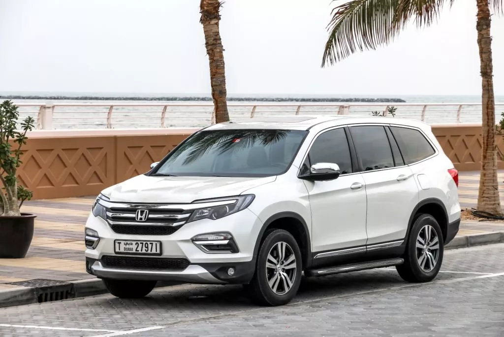 Honda Pilot parked by the street