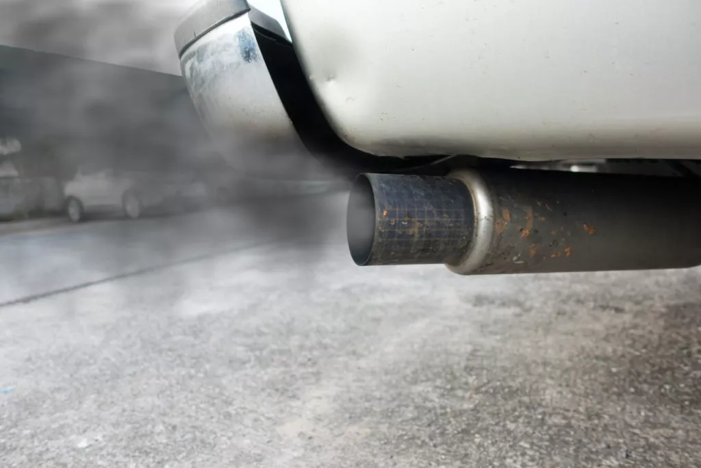 car tail pipe emitting black smoke
