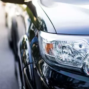 black car headlight close up detail