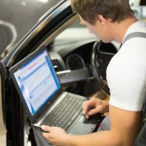 car mechanic checking P0087