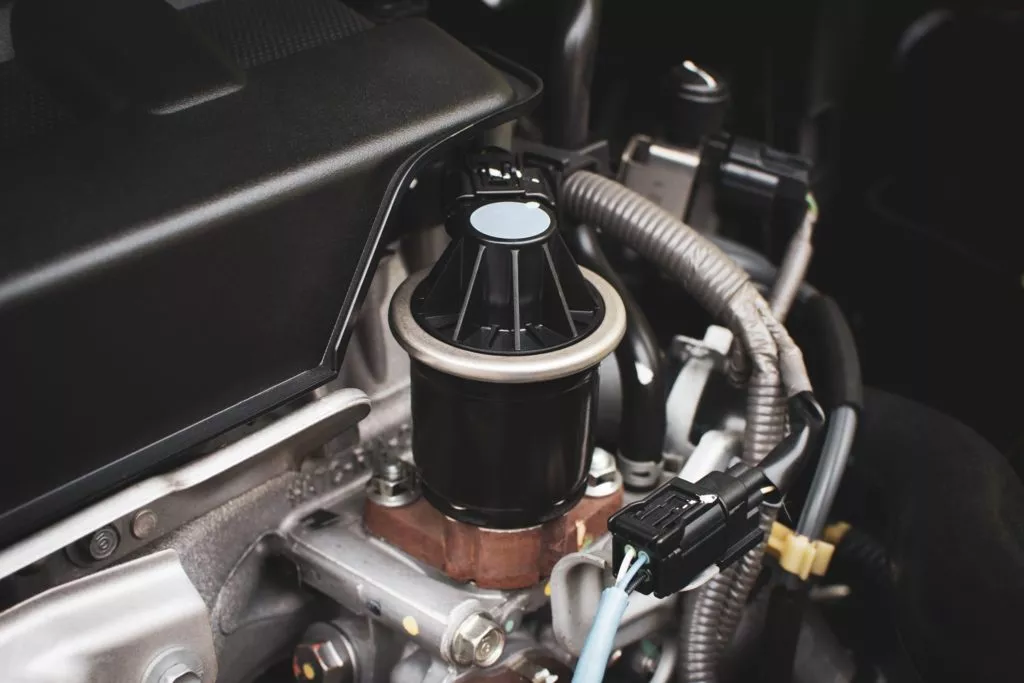 Closeup of exhaust gas recirculation in engine compartment