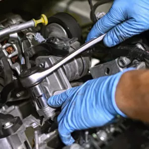 mechanic fixing valve cover gasket
