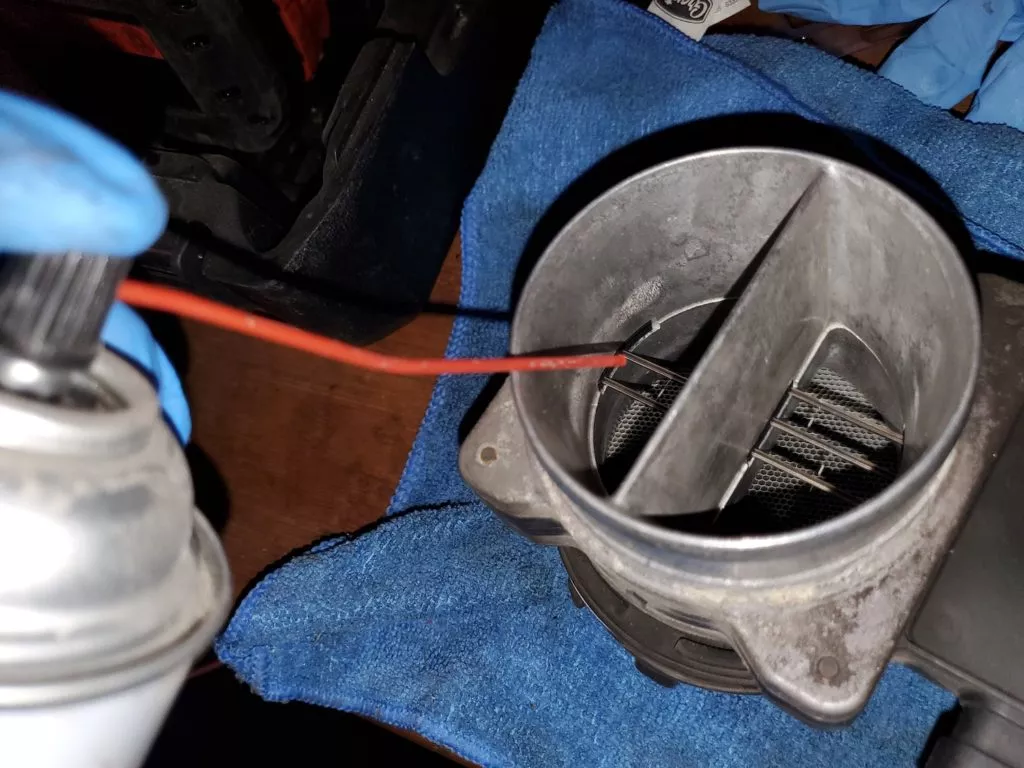 cleaning spray onto maf housing