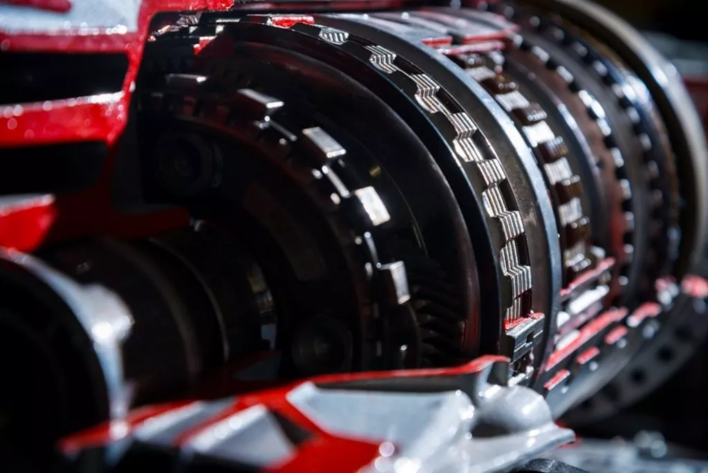 man capturing the details of a car transmission 1