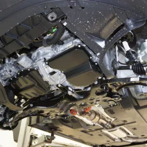 car lifted with engine view