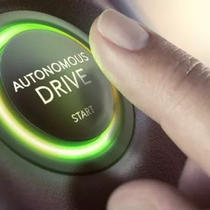 man engaging autonomous driving mode of car