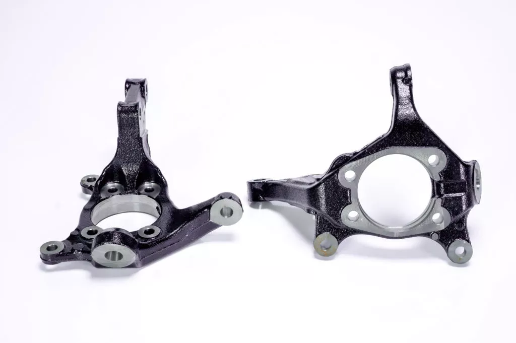 two aftermarket steering knuckles