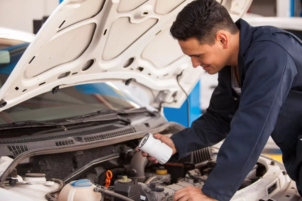 mechanic replacing oil filter