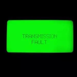 Old retro display panel with green glowing light showing transmission fault