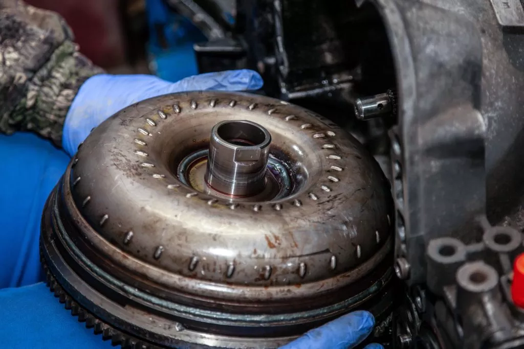 mechanic holding torque converter