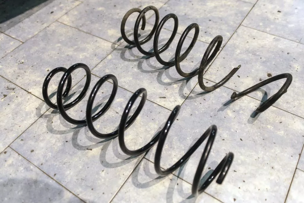 New and old shock absorber coil spring