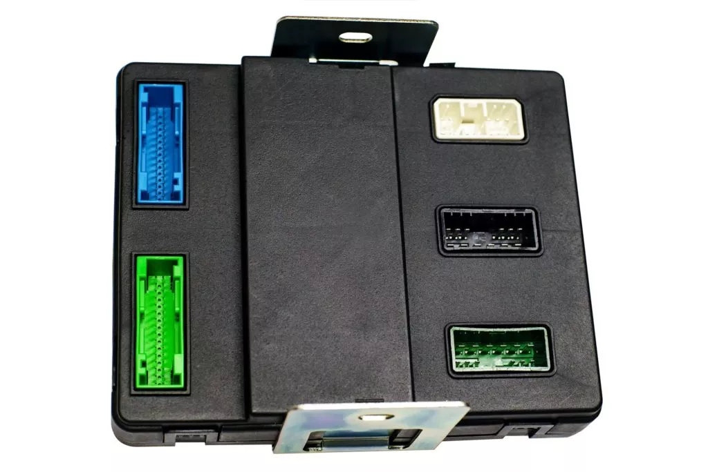 black engine control module in white background