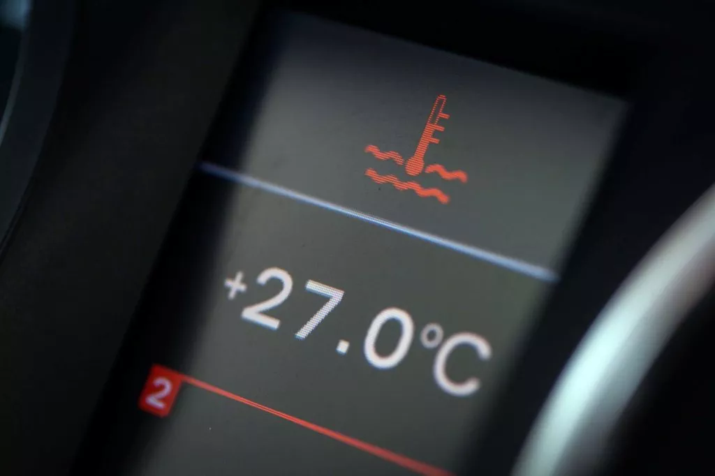 car electronic dashboard showing coolant temperature