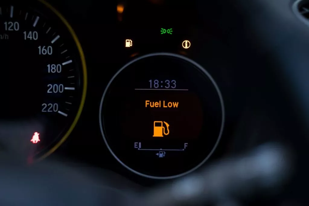 digital warning sign of low fuel turned on