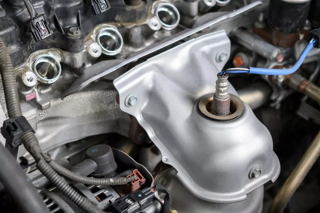 Clear close up view of an Upstream Oxygen Sensor In a Car