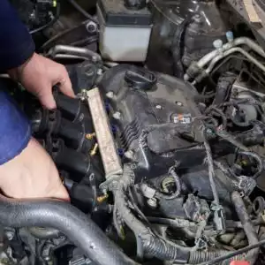 mechanic performs intake manifold inspection