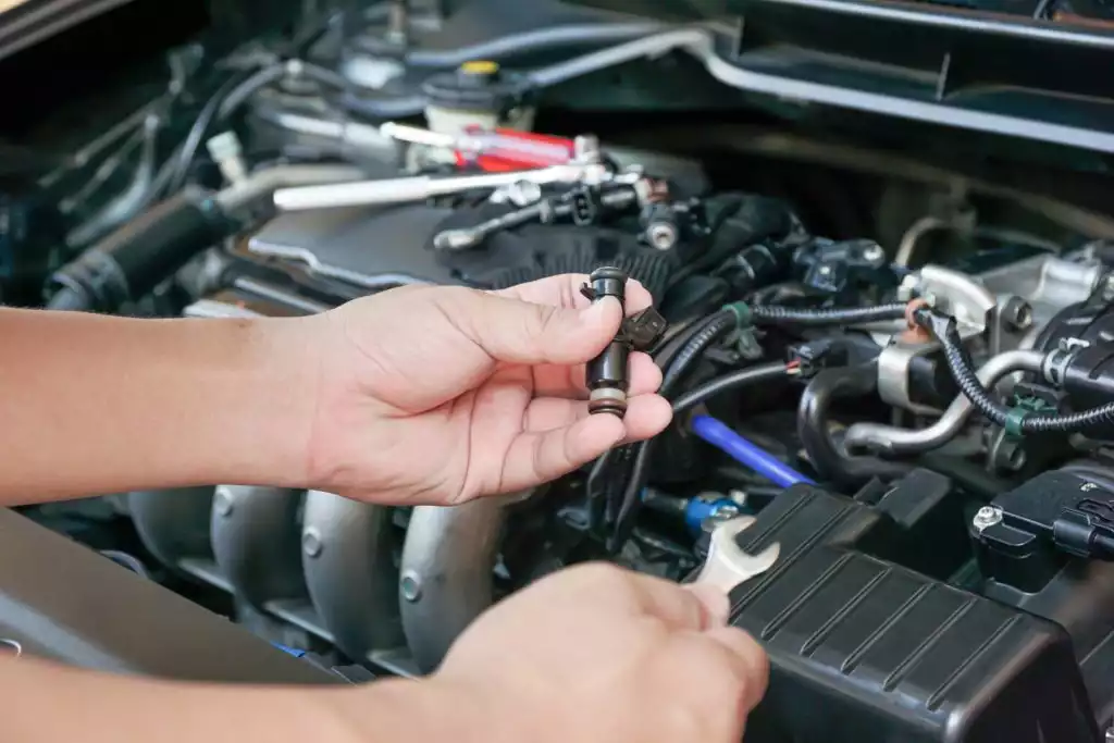 hand holding a fuel injector