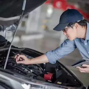 Asian at Work Assess the Condition of the Vehicle after getting P050D code