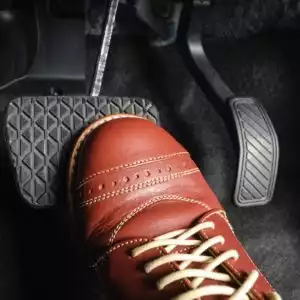 shoe stepping on brake pedal