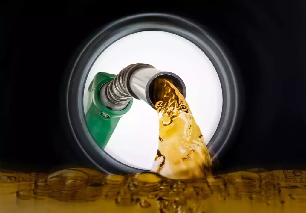gas poured inside gas tank point of view